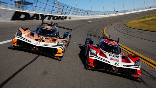 2026 Acura ARX-06 in red profile racing on a track with Grand Prix of Long Beach Logo