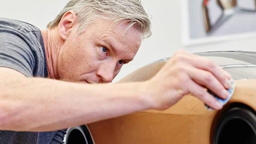 Acura Design Studio desinger working on NSX scale model.