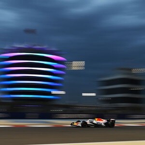 Visa Cash APP Racing Bulls Team vehicle on the rice track with buildings on the back  Visa Cash APP Racing Bulls Team vehicle on the rice track with buildings on the back