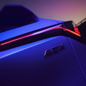 Acura 2025 ADX shown in Platinum White Pearl with Distinct Chicane™ LED taillights enhance the bold design of the ADX.
