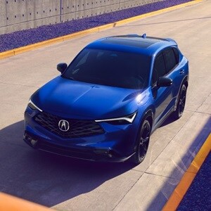 Acura 2025 ADX shown in Adriatic Sea Blue Metallic with Striking 19-in alloy wheels, illuminating LED fog lights and bold black exterior accents included in the A-Spec® Package add an athletic edge to the ADX.