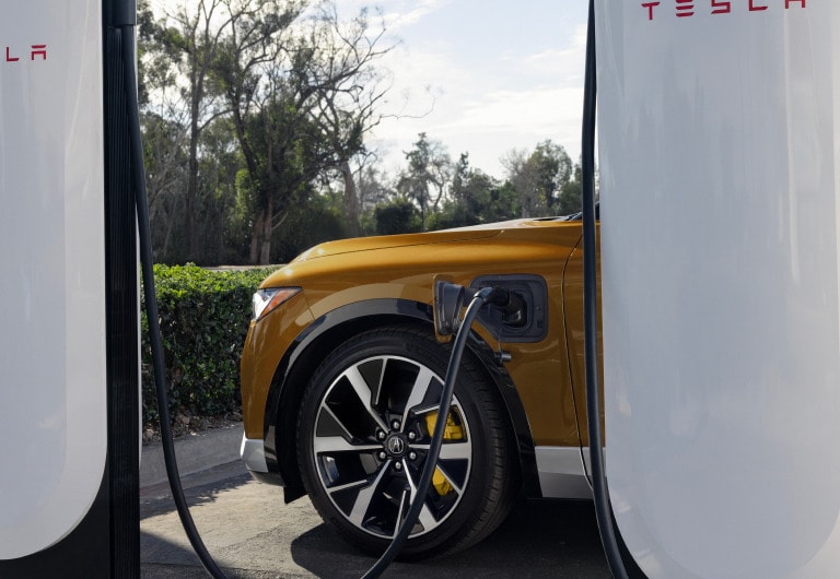 2025 Acura ZDX charging on the road