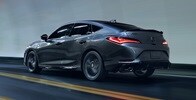 2023 Integra A-Spec in Liquid Carbon Metallic with accessories, driving in a tunnel rear view 2023 Integra A-Spec in Liquid Carbon Metallic with accessories, driving in a tunnel rear view