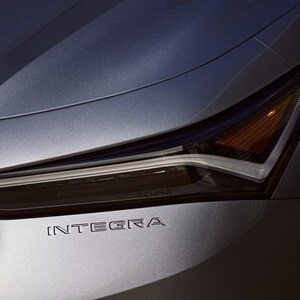 2023 Integra headlight with embossed badge detail 2023 Integra headlight with embossed badge detail