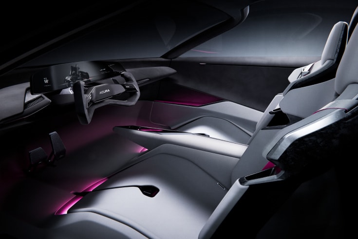 2026 Acura cockpit featuring a futuristic yoke steering wheel and wide digital dashboard display.