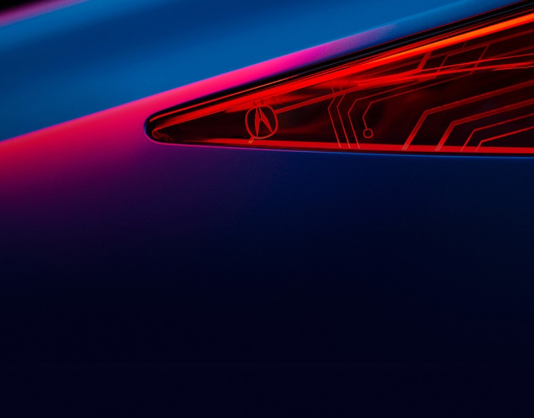 Close-up of an Acura front headlight. Close-up of an Acura front headlight.