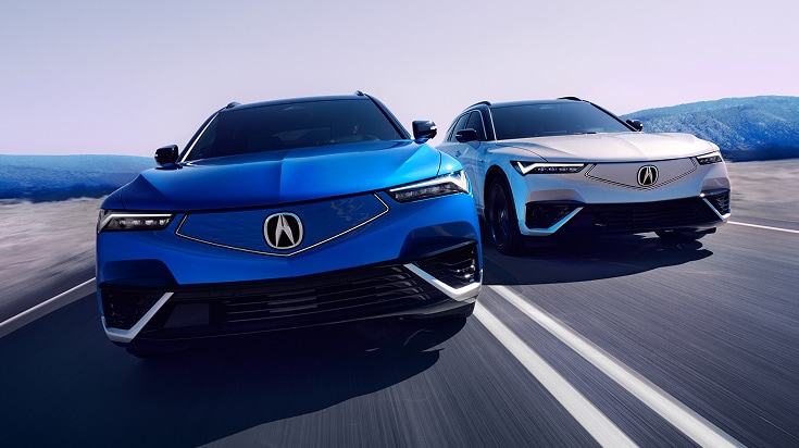 2024 Acura ZDX Type-S in Double Apex Blue Pearl and Frostline White Pearl, driving on a road (Premium All-Electric SUV). 2024 Acura ZDX Type-S in Double Apex Blue Pearl and Frostline White Pearl, driving on a road (Premium All-Electric SUV).