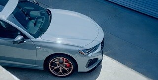 Acura TLX Type S in Urban Gray Pearl rear view on the road Acura TLX Type S in Urban Gray Pearl rear view on the road