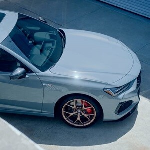 Acura TLX Type S in Urban Gray Pearl rear view on the road Acura TLX Type S in Urban Gray Pearl rear view on the road