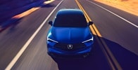 Acura 2025 ADX A-Spec with Advance Package in Adriatic Sea Blue Metallic front view on the road Acura 2025 ADX A-Spec with Advance Package in Adriatic Sea Blue Metallic front view on the road