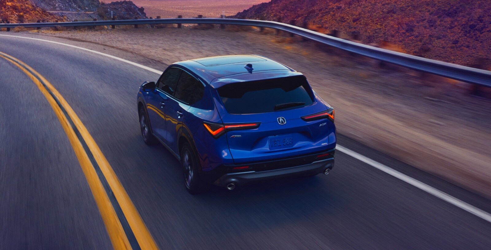 Acura ADX rear road view