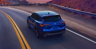 Acura 2025 ADX A-Spec with Advance Package in Adriatic Sea Blue Metallic rear view on the road Acura 2025 ADX A-Spec with Advance Package in Adriatic Sea Blue Metallic rear view on the road