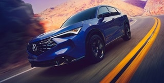Acura 2025 ADX A-Spec with Advance Package in Adriatic Sea Blue Metallic on the road Acura 2025 ADX A-Spec with Advance Package in Adriatic Sea Blue Metallic on the road