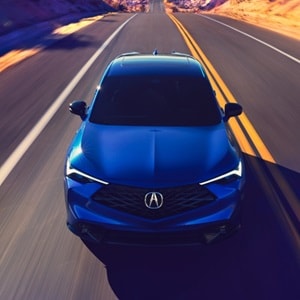 Acura 2025 ADX A-Spec with Advance Package in Adriatic Sea Blue Metallic front view on the road Acura 2025 ADX A-Spec with Advance Package in Adriatic Sea Blue Metallic front view on the road