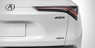 2026 Acura ADX shown in Platinum White Pearl featuring the Gloss Black Emblems accessories.