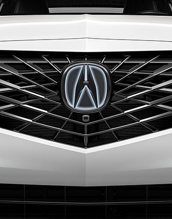 2026 Acura ADX shown in Platinum White Pearl featuring the Illuminated Front Emblem accessory.