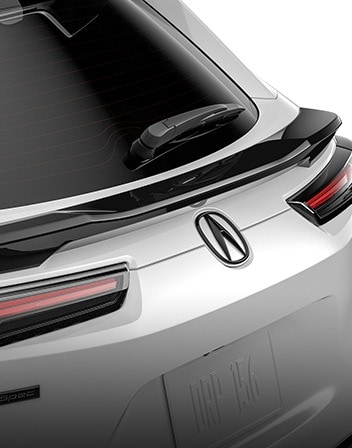 2026 Acura ADX shown in Platinum White Pearl featuring the Mid-Tailgate Spoiler accessory.
