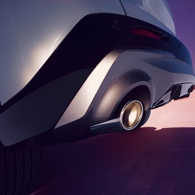 2026 Acura ADX A-Spec shown in Platinum White Pearl, showing a detail of the exhaust tip.