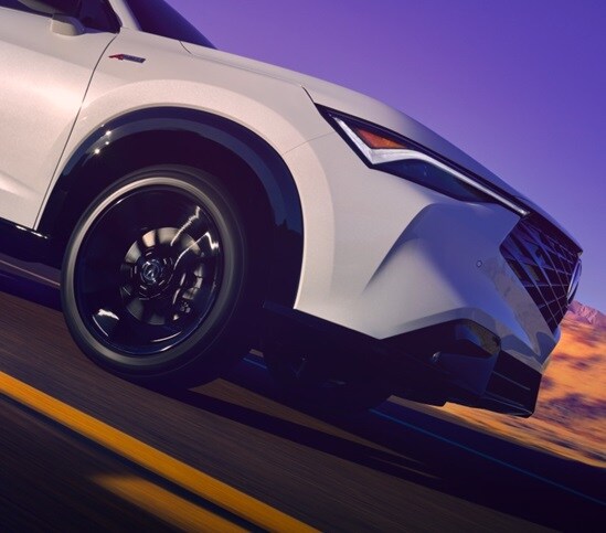 Acura 2026 ADX on the road with the headlights focused