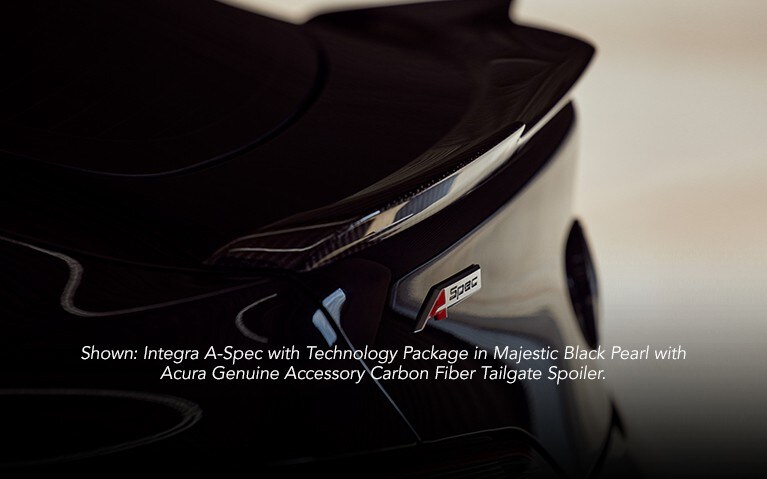 Acura Integra with carbon fiber tailgate spoiler accessory close up