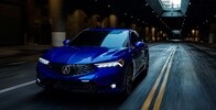 2025 Integra 3/4 front view driving in Apex Blue Pearl
