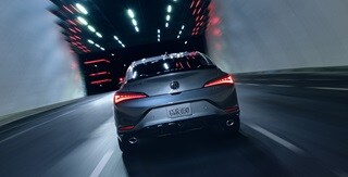 2025 Integra in Liquid Carbon Metallic, rear view driving in a tunnel