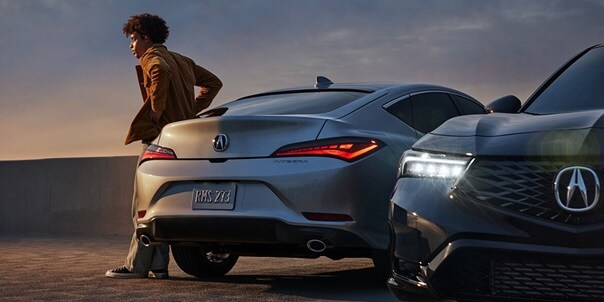 Two 2025 Integra in a roof top parkinglot one with rear view and the other with front view