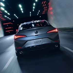 2025 Integra in Liquid Carbon Metallic, rear view driving in a tunnel