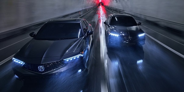 Two 2025 Integra driving in a tunnel, top front view