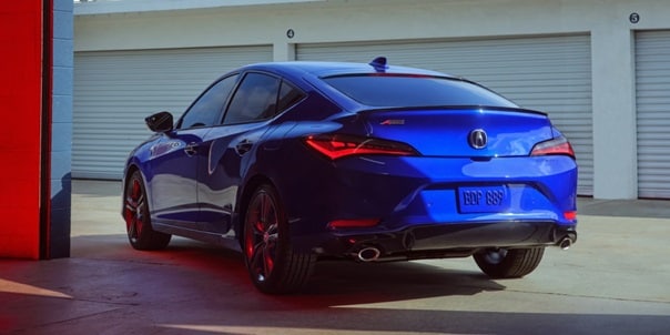 2025 Integra rear view driving on the road
