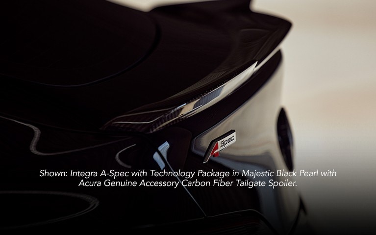 Acura Integra with carbon fiber tailgate spoiler accessory close up