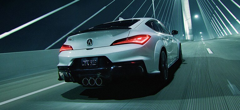 2026 Acura Integra Type S shown in Platinum White Pearl on a Bridge at night