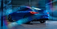 2026 Acura Integra A-Spec with Technology Package in Double Apex Blue Pearl rear view. 2026 Acura Integra A-Spec with Technology Package in Double Apex Blue Pearl rear view.