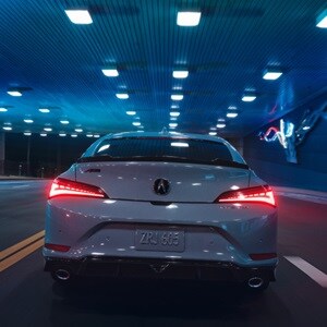 2026 Acura Integra in Urban Gray Pearl, rear view driving in a tunnel. 2026 Acura Integra in Urban Gray Pearl, rear view driving in a tunnel.