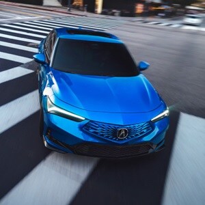 2026 Acura Integra in Double Apex Blue front view. 2026 Acura Integra in Double Apex Blue front view.