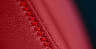 2026 Acura Integra red stitching detail. 2026 Acura Integra red stitching detail.