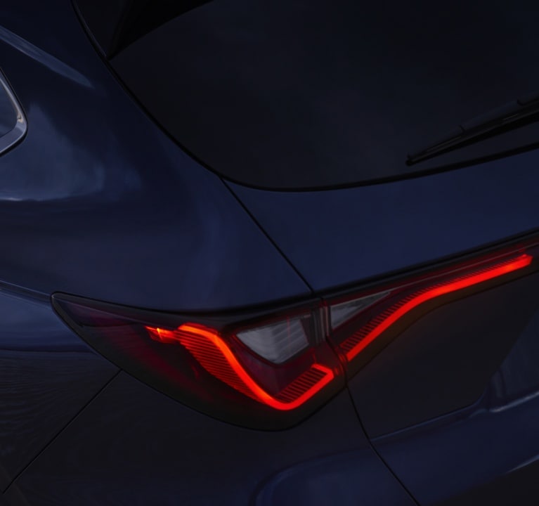 2025 Acura MDX with Jewel Eye® LED headlights and darkened Chicane™ LED taillights