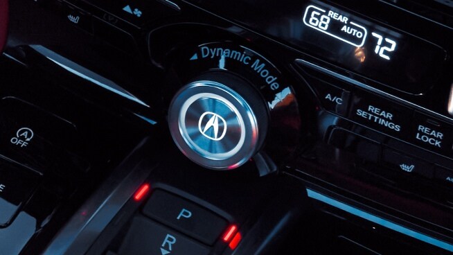 Acura MDX interior image highlighting the premium cockpit and drive-mode controls.