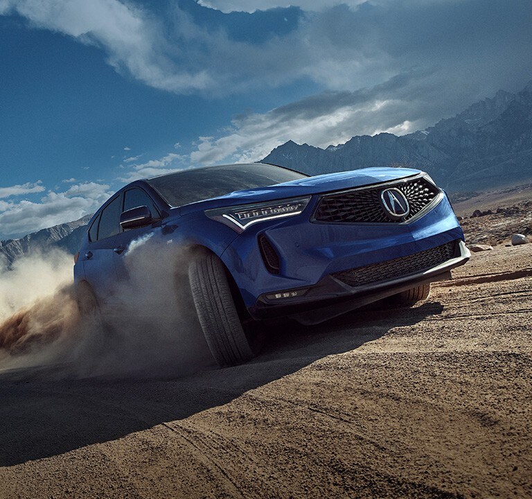 2022 RDX A-Spec in Apex Blue Pearl driving in the desert
