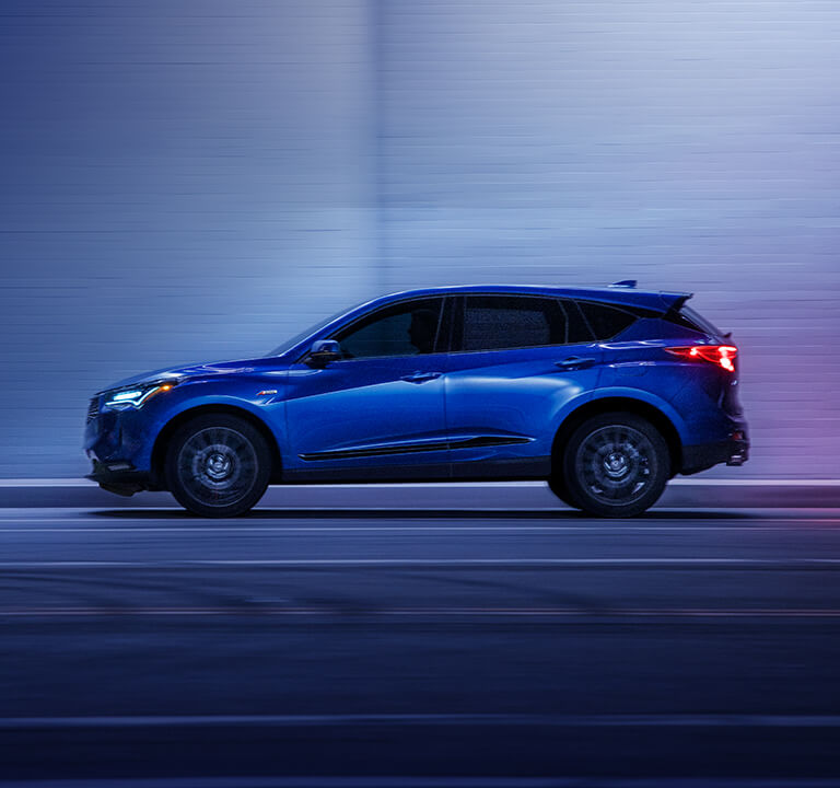 2023 RDX A-Spec Advance side profile in Apex Blue Pearl driving