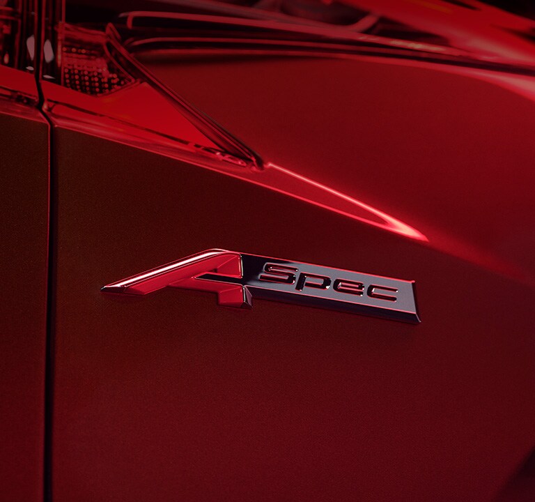 2023 RDX A-Spec fender badge on Performance Red Pearl premium paint close up