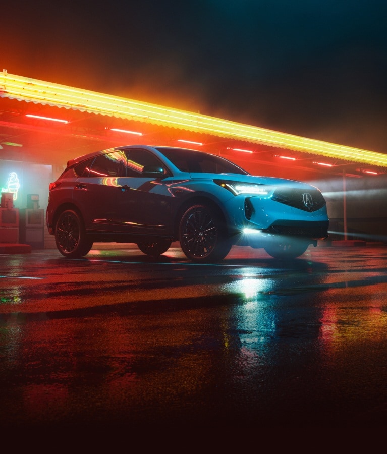 Acura 2026 RDX A-Spec Advance in Urban Gray Pearl passenger profile in a warehouse