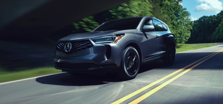 Acura 2026 RDX SH-AWD in Liquid Carbon Metallic riding on the road