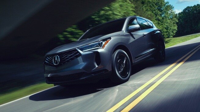 2026 Acura RDX driving on a winding road