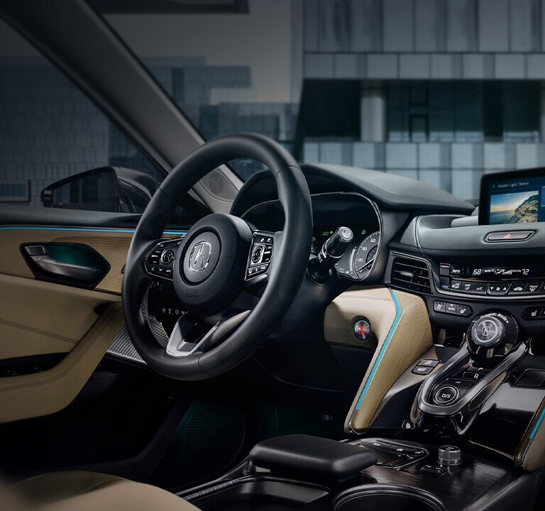TLX Advance package cabin with parchment interior and customizable ambient interior lighting.