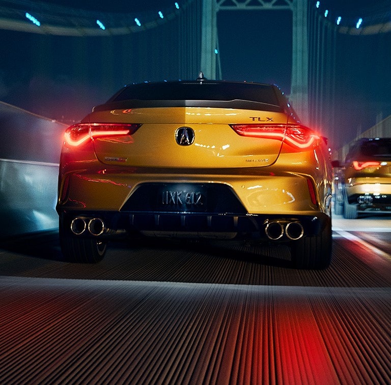 TLX Type S rear view in Tiger Eye Pearl crossing a bridge