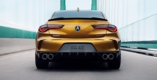 Acura 2024 TLX Type S in Tiger Eye Pearl Chicane™ LED taillights frame the rear Acura 2024 TLX Type S in Tiger Eye Pearl Chicane™ LED taillights frame the rear