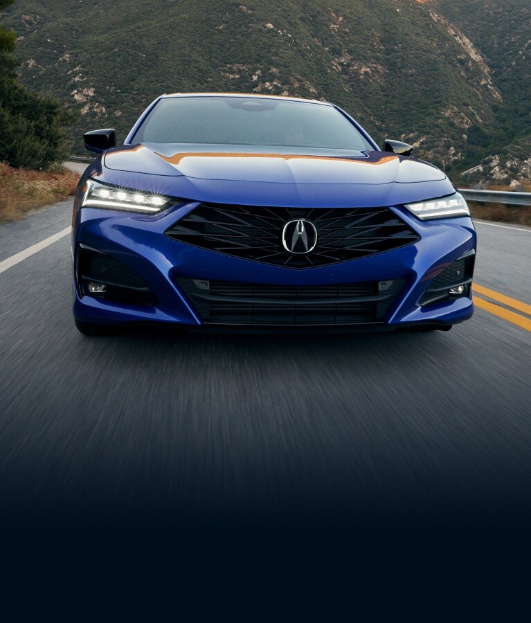 2025 TLX in Apex Blue Pearl on the road