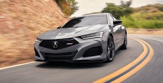2025 Acura TLX Type S in Urban Gray Pearl 3/4 front view on the road.