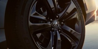 2025 Acura TLX Technology Package in Liquid Carbon Metallic with gloss black 20-inch alloy wheels.
